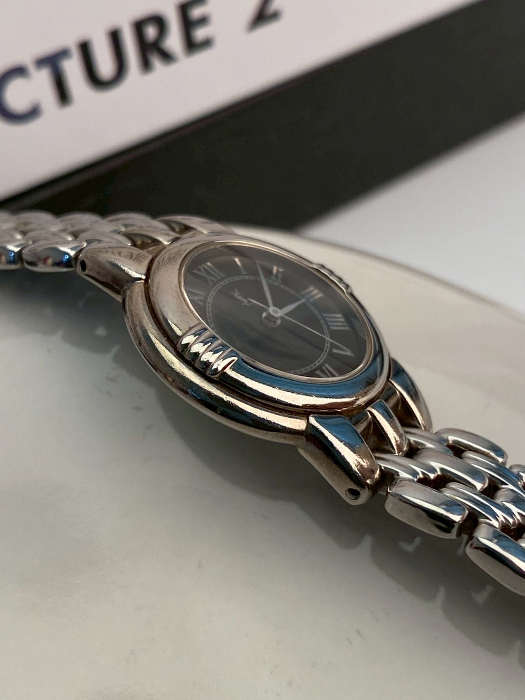 Ysl black dial silver watch